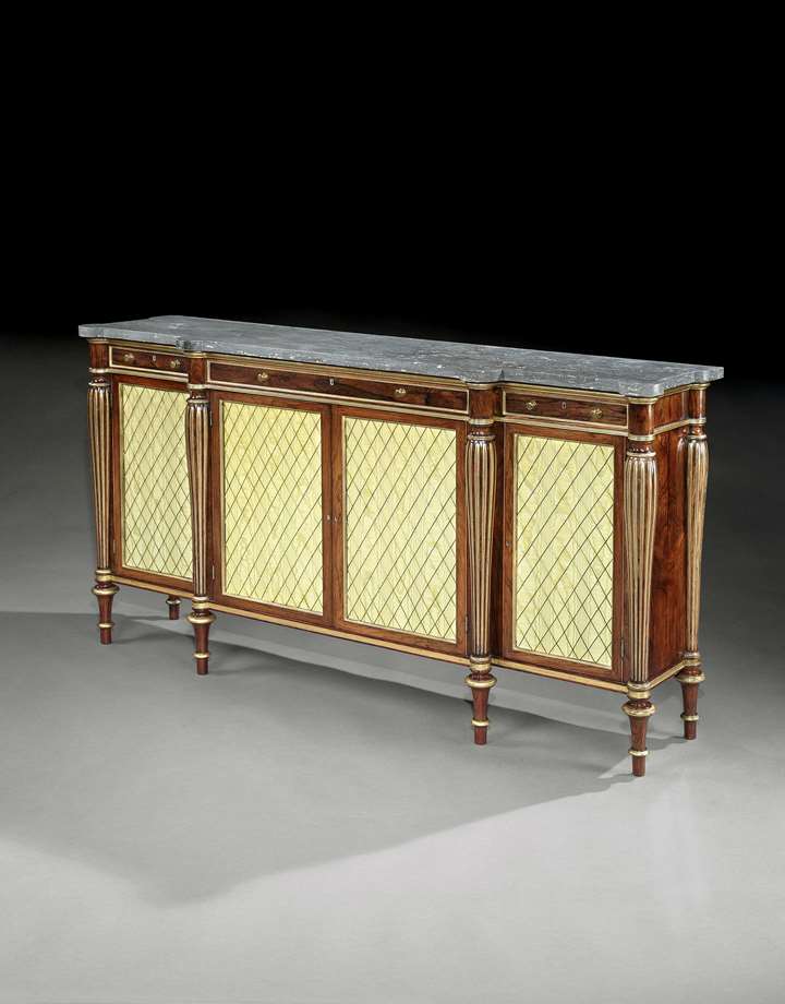 A regency parcel gilt rosewood side cabinet